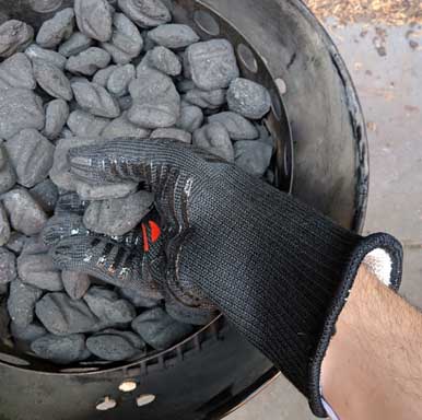 Using heat resistant bbq gloves