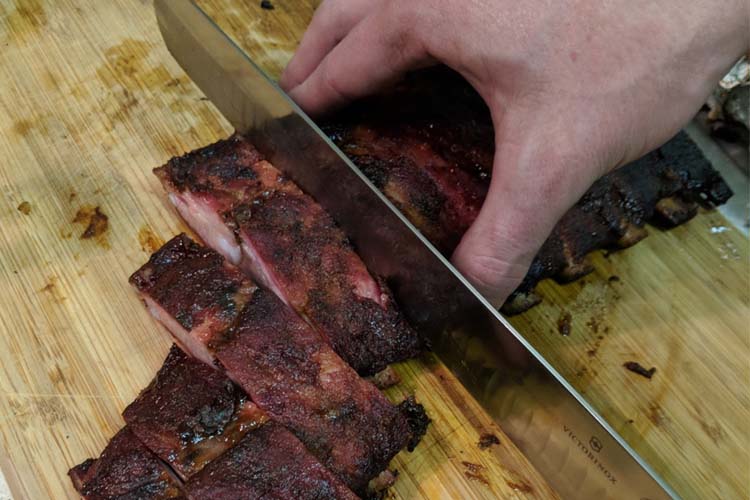 Victorinox grant knife slicing pork ribs