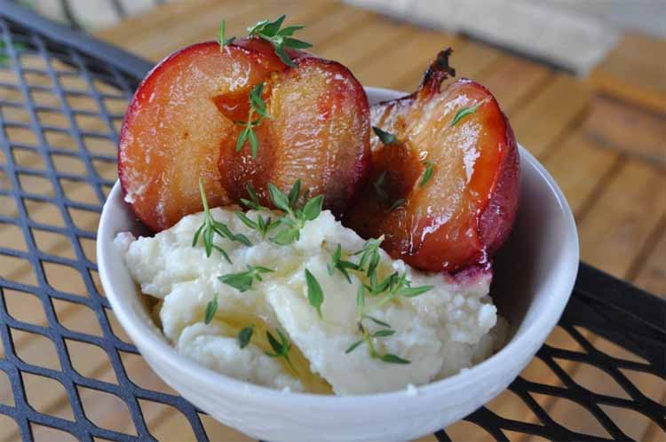 Grilled plums in a bowel with frozen yoghurt