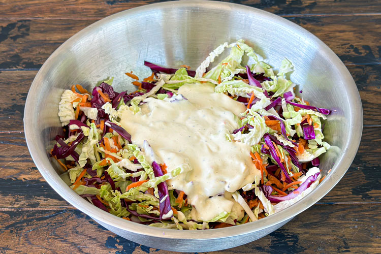 mixed slaw with dressing on top
