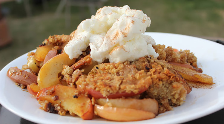 barbecued apple crisp topped with cream