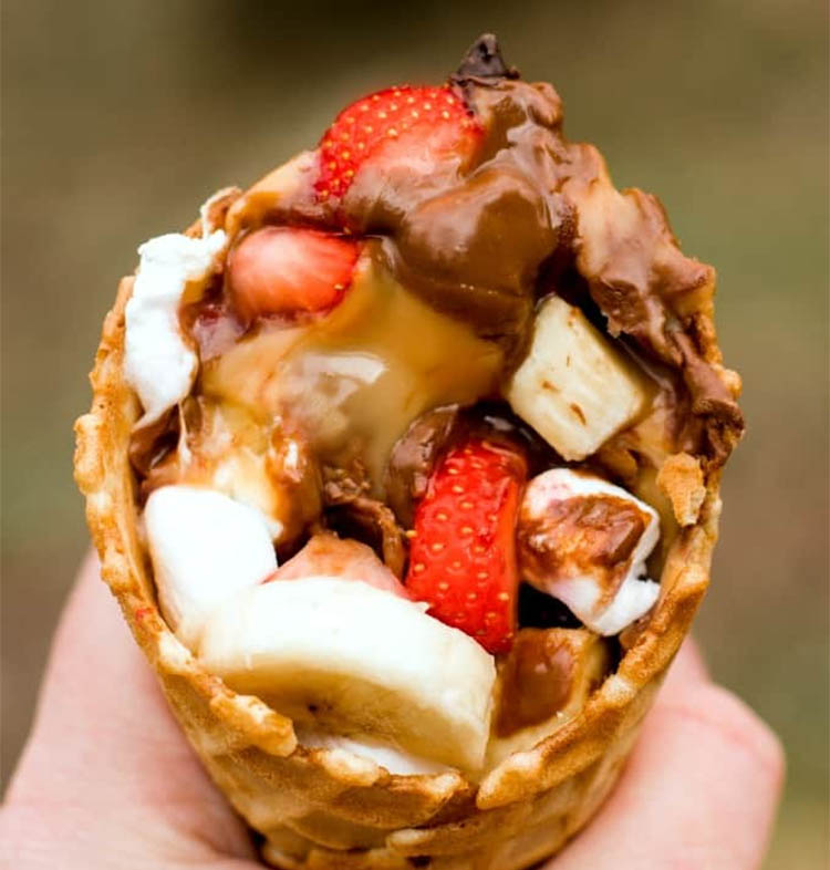 campfire cone filled with marshmellows banan strawberries chocolate