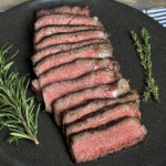 reverse sear steak sliced and served on plate