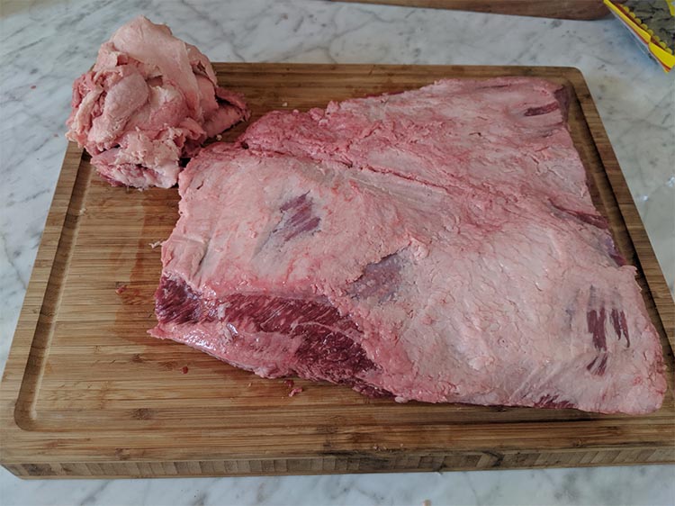 wood butcher block with beef brisket