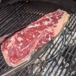 Frozen steak on grill