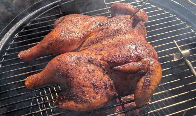 Spatchcocked whole chicken on a smoker