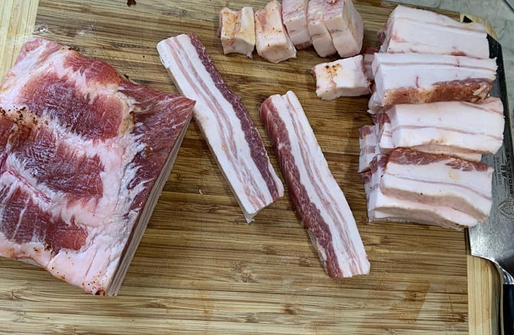 pork belly cuts on a wooden board