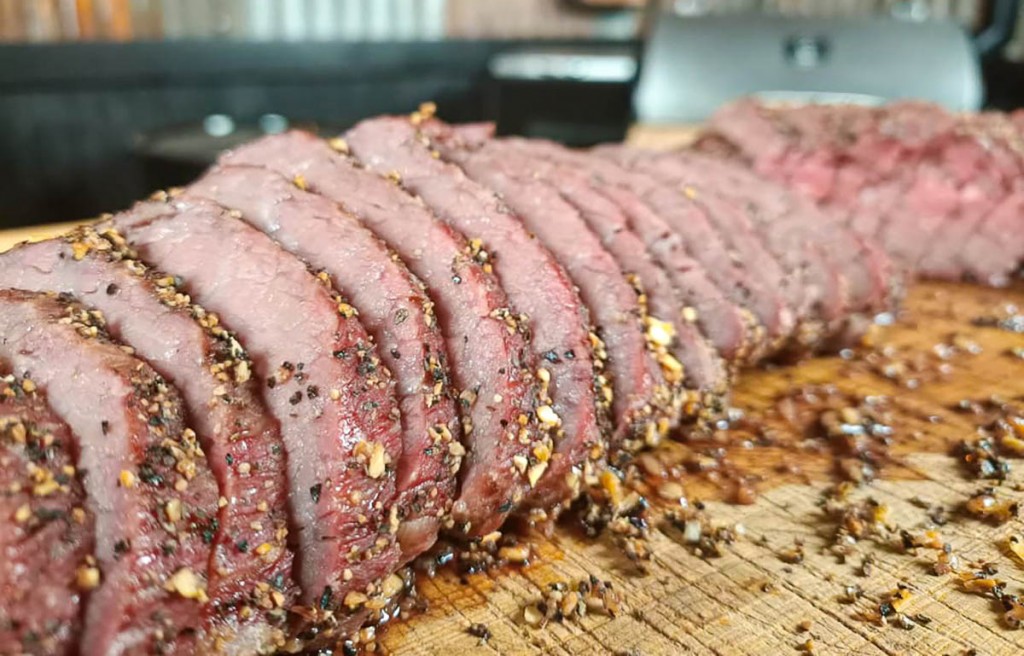 smoked tri-tip on a wooden board