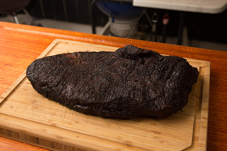 smoked brisket on a wooden board