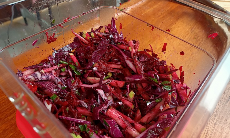 apple and beets slaw in a container