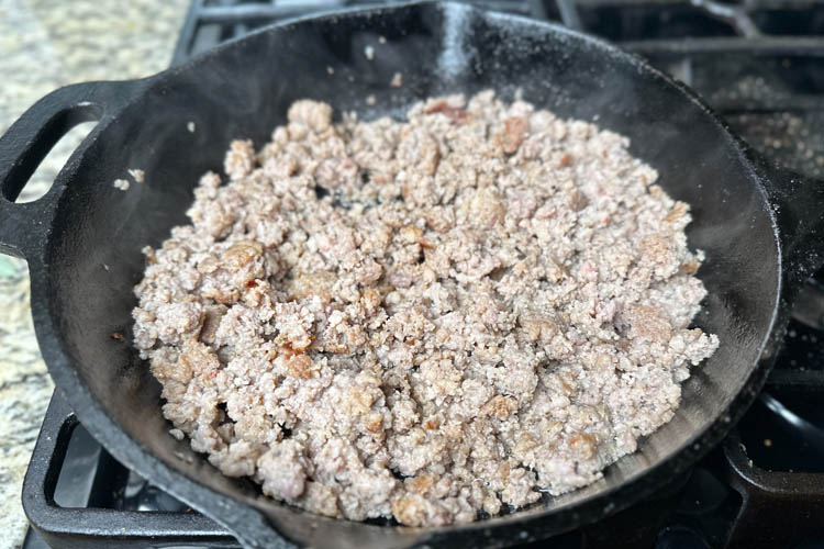 cooked sausage in a cast iron skillet