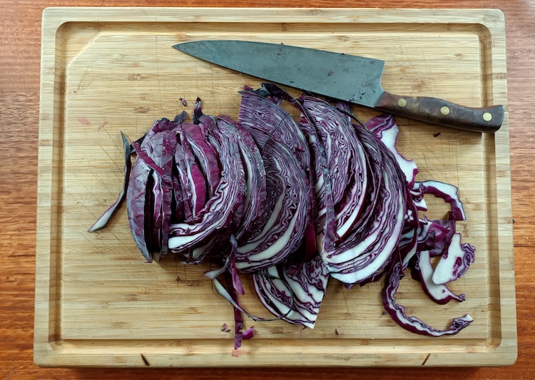 sliced red cabbage on a wooden board