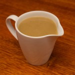 Homemade gravy in a pouring jug