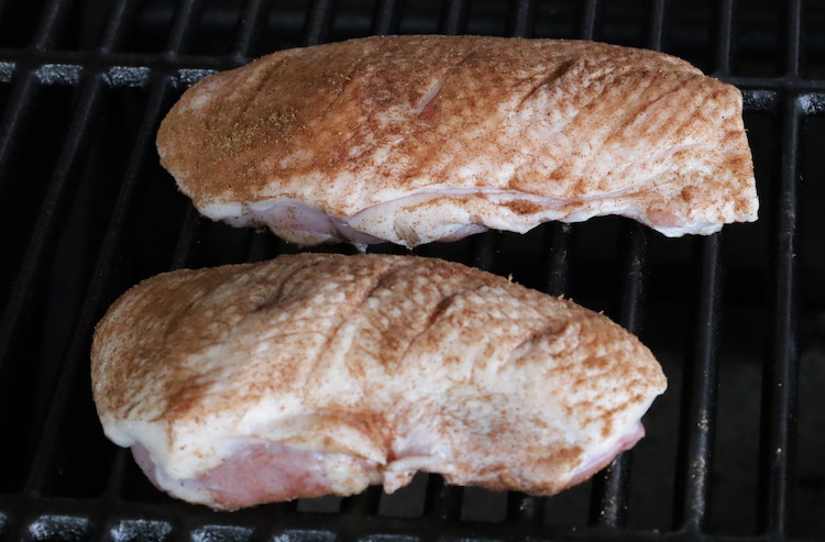 smoked duck breasts on a grill