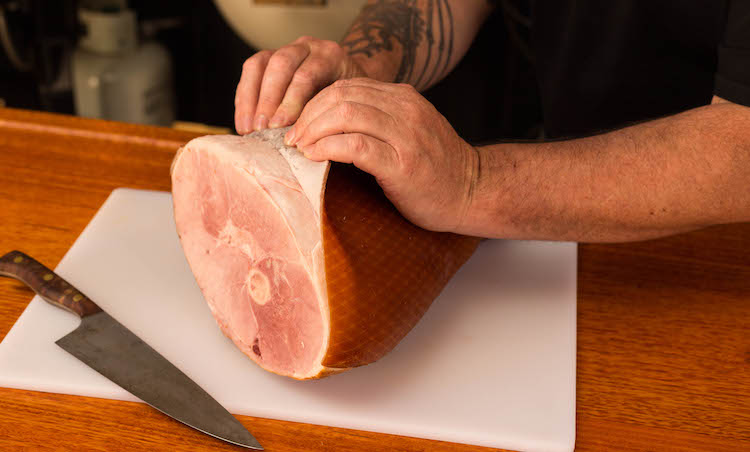 removing the skin from the ham