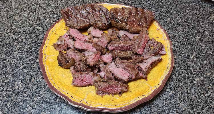 sliced picanha steaks on a plate