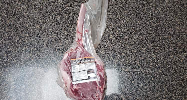 vacuum-sealed raw Certified Piedmontese Tomahawk steak