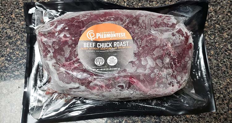 vacuum-sealed raw Certified Piedmontese beef chuck roast