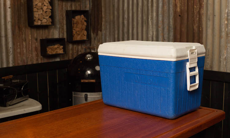 blue cooler on a wooden table