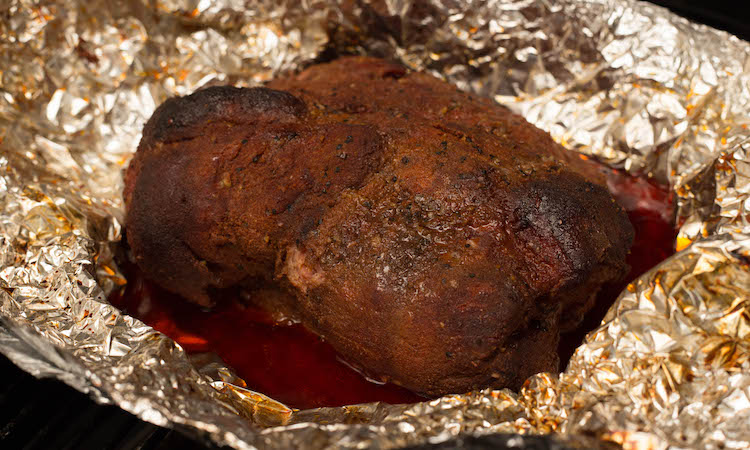 smoked pork butt wrapped in foil