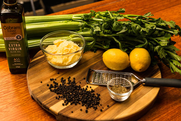celery and parmesan salad ingredients on a wooden board