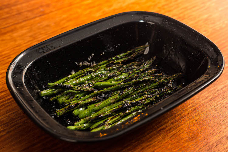 char grilled asparagus in a baking tray