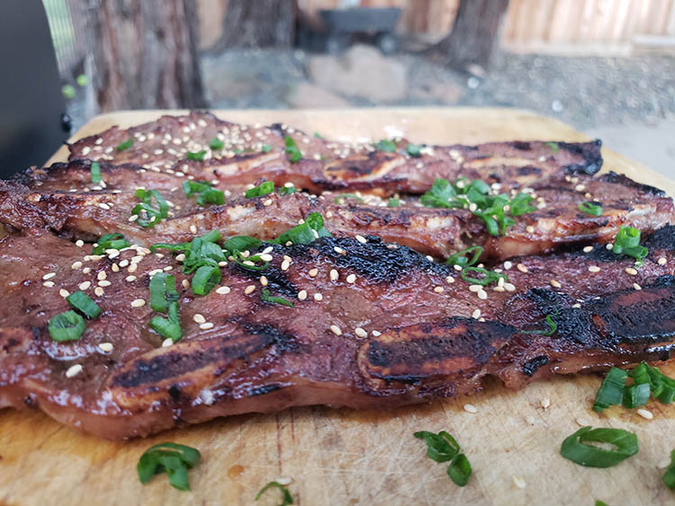 Korean-style short ribs on a wooden booard
