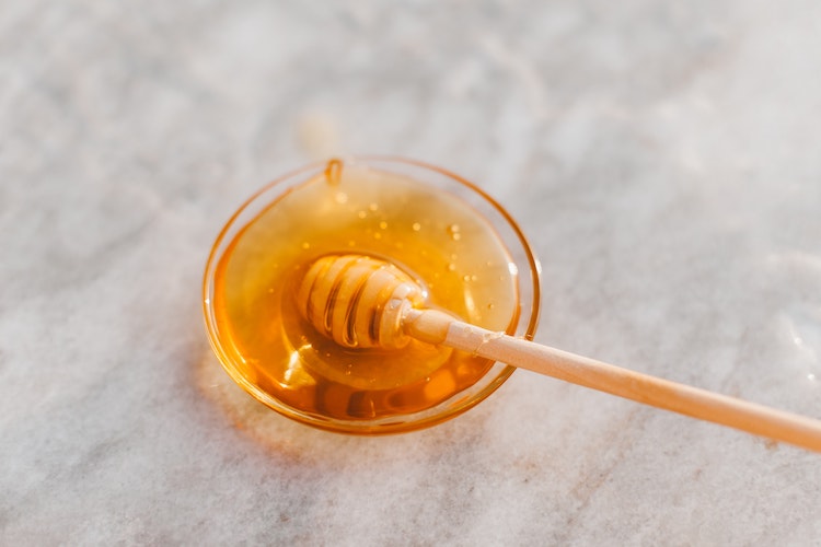 honey in a small glass bowl