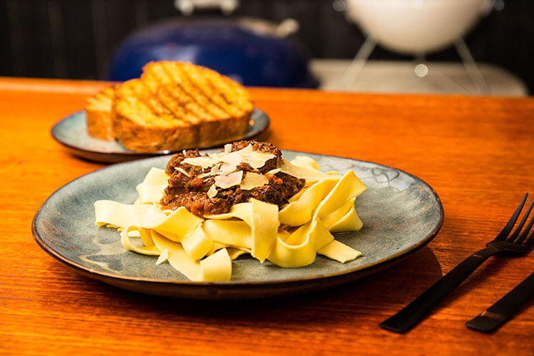 leftover brisket bolognese with pasta and garlic bread