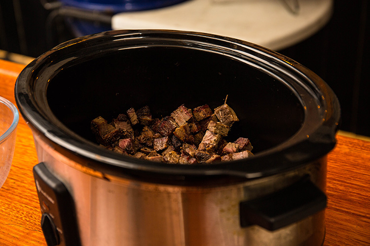 diced brisket in a slow cooker