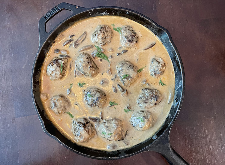 smoked venison meatball stroganoff in a cast iron pan