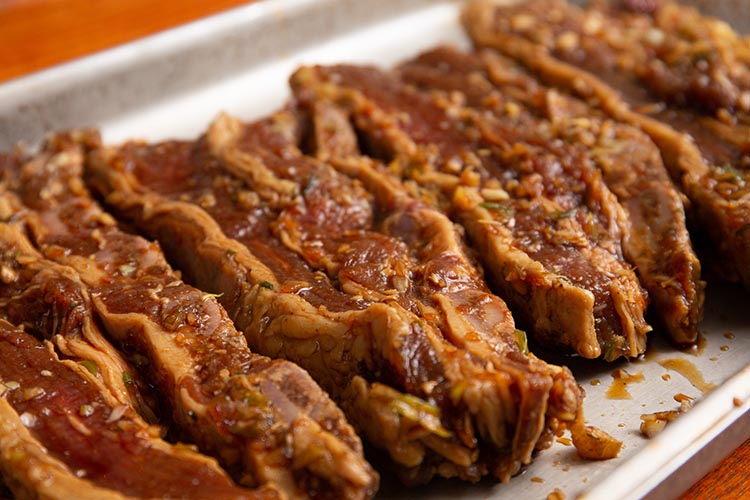 marinated korean beef short ribs on a metal tray
