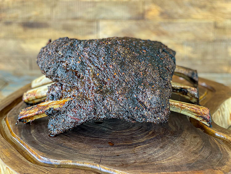 rack of smoked beef ribs on a chopping board