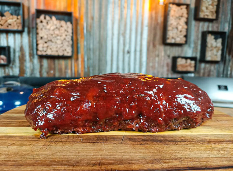 smoked meatloaf on a wooden board