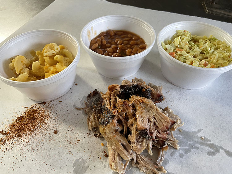 individual bowls of mac, beans and slaw, pulled pork on board