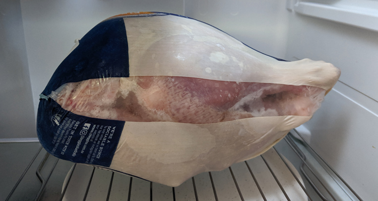 frozen turkey thawing in refridgerator