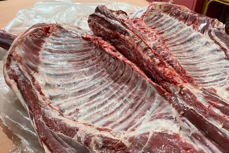 raw lamb ribs pulled apart