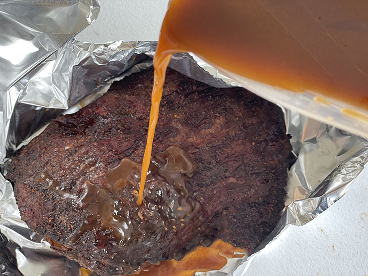 beef brisket wrapped in foil with added beef broth