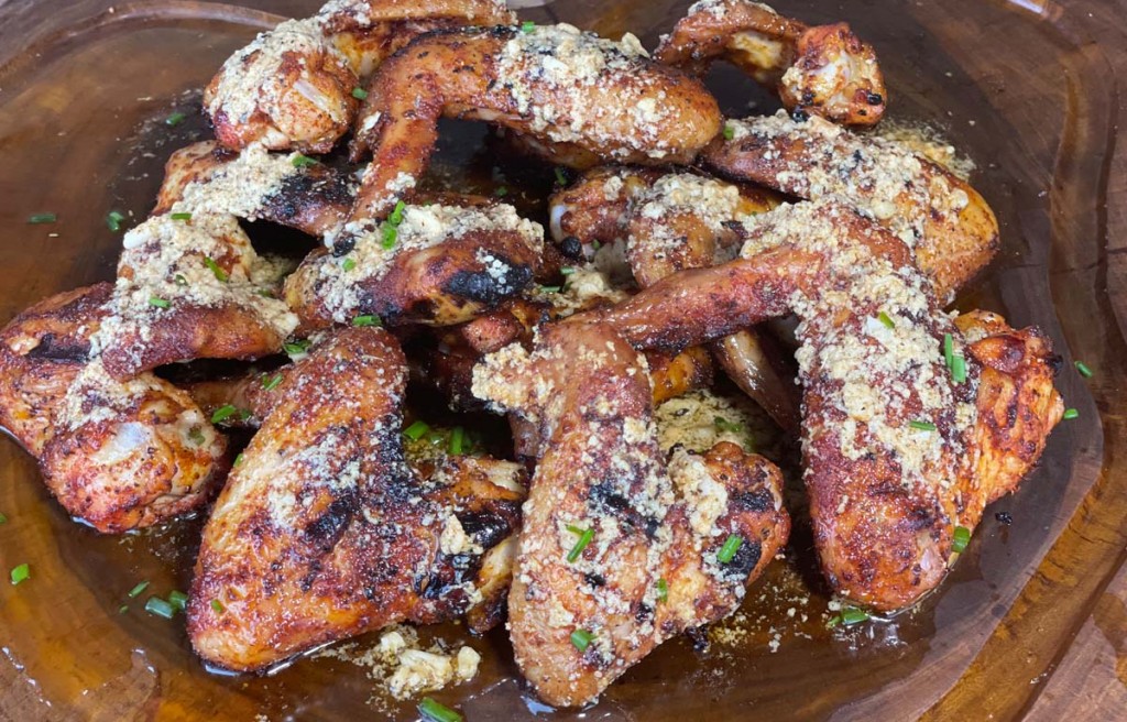 cooked garlic, butter, parmesan wings on a plate