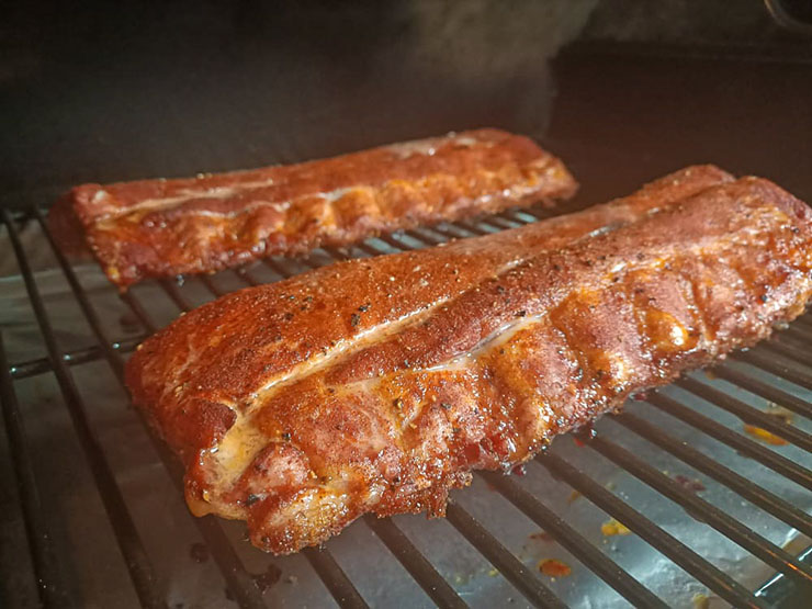 pork baby back ribs smoking on the pellet grill