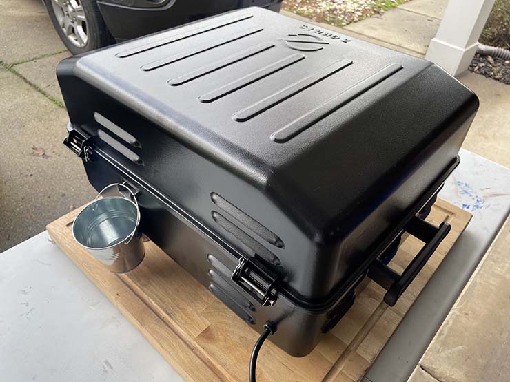 A grease bucket on the Z Grills Cruiser 200A portable pellet grill