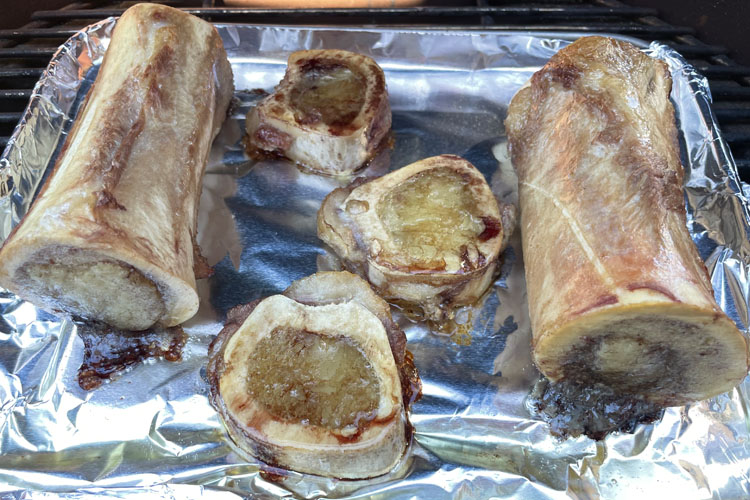 cooked marrow bone on foil lined tray