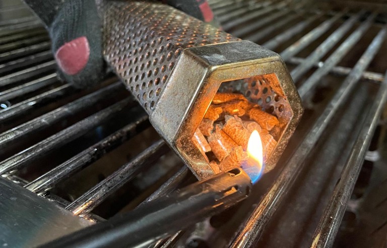 smoke box being lit with a gas lighter