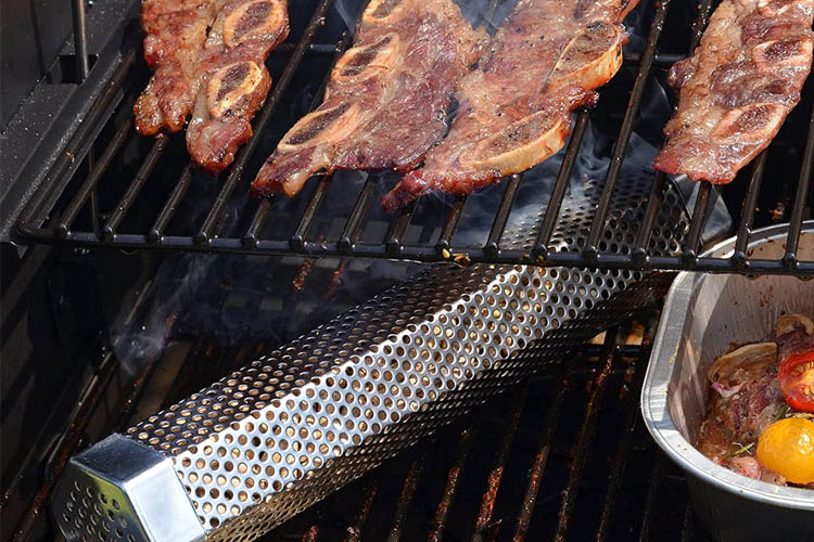 smoke tube on bbq under a rack of ribs