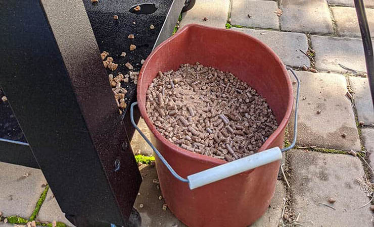 wood pellets in a plastic bucket