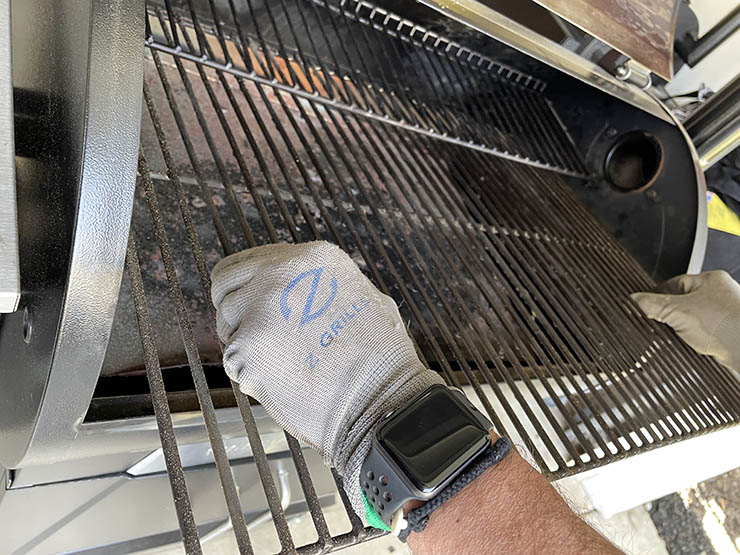 removing dirty grates from a pellet grill