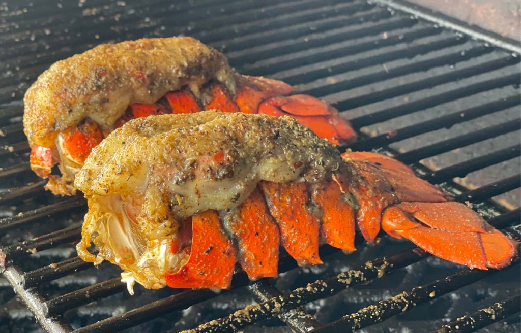 cooked smoked lobster tails on the grill