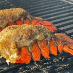 cooked smoked lobster tails on the grill