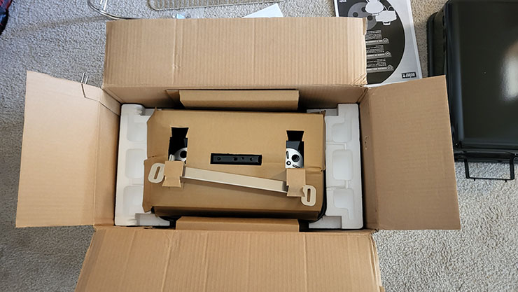 weber go-anywhere grill packaged in a cardboard box