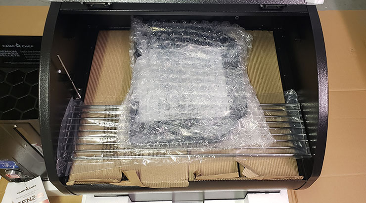Camp Chef DLX 24 assembly parts packaged in a bubble wrap and cardboard